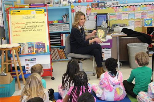 AB reading a book aloud